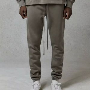 Fear of God Essentials Sweatpants in Cement